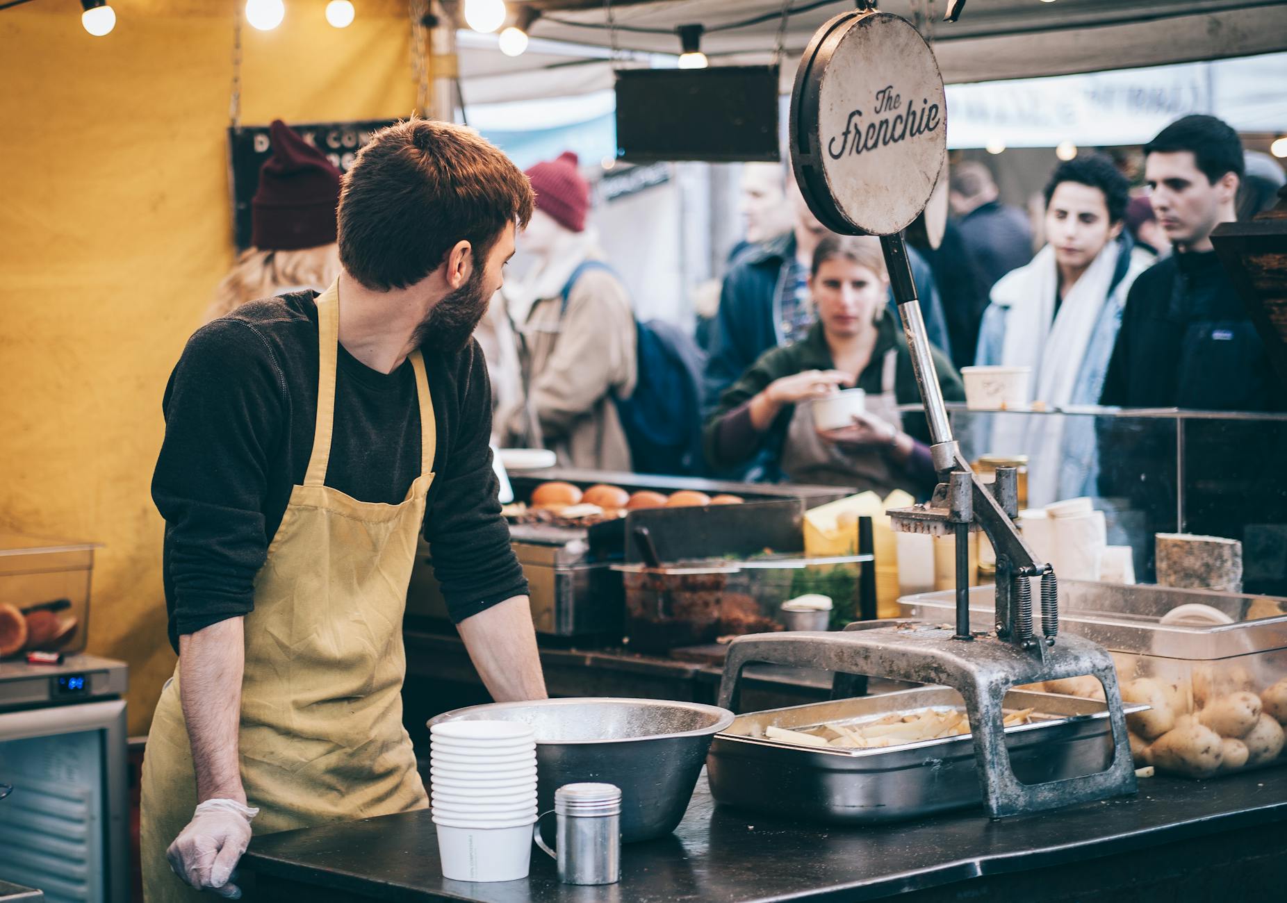 man standing in front of bowl and looking towards left